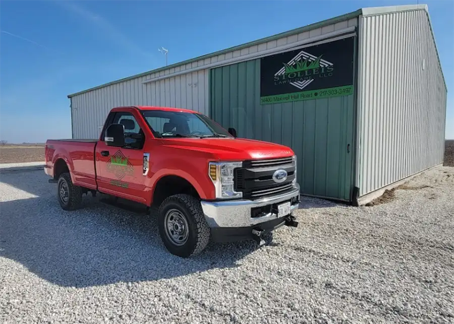 Stolleis Lawn Care company truck, bright red, parked in front of business location - Springfield, IL