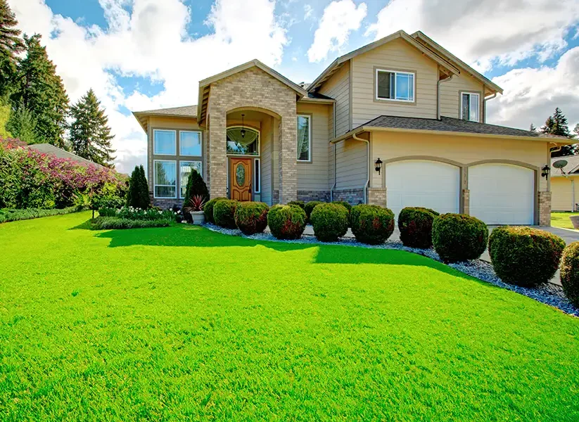 Beautiful, well-kept front lawn of residential home, enhanced curb appeal - Springfield, IL