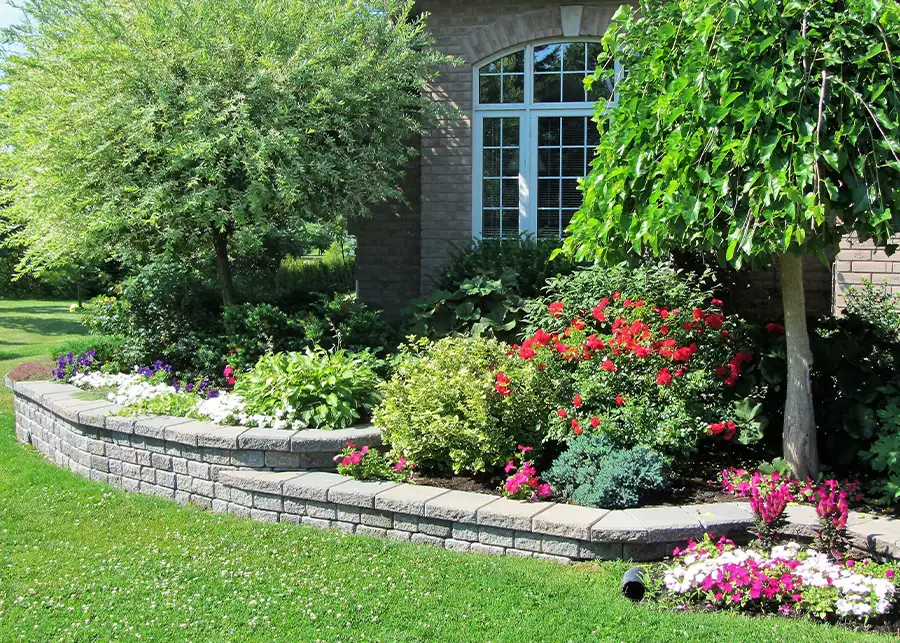 professional landscaping services, rock installation, small, but functional retaining walls around front yard garden - Springfield, IL